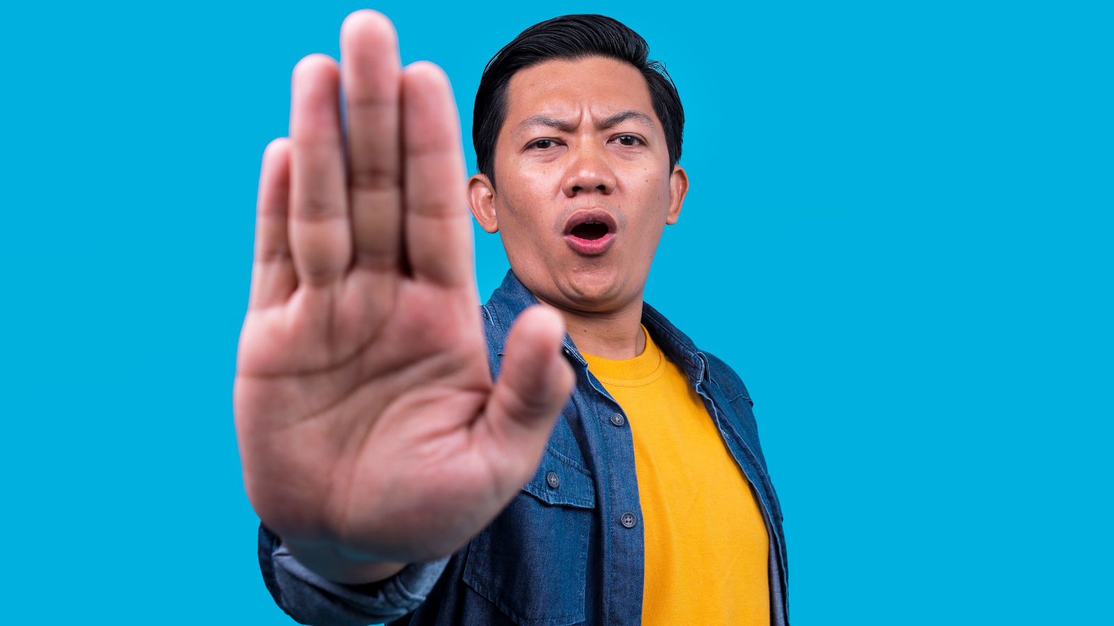 Gamer focused on screen with overlay interface elements